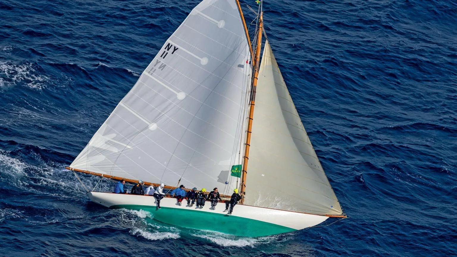 Classic yacht under full sail on deep blue sea