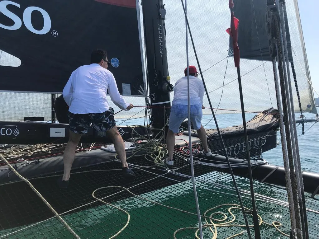 Rosey alumni learning sail handling aboard a yacht on Lake Geneva